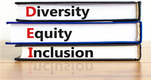 3 stacked books labled Diversity, Equity & Inclusion